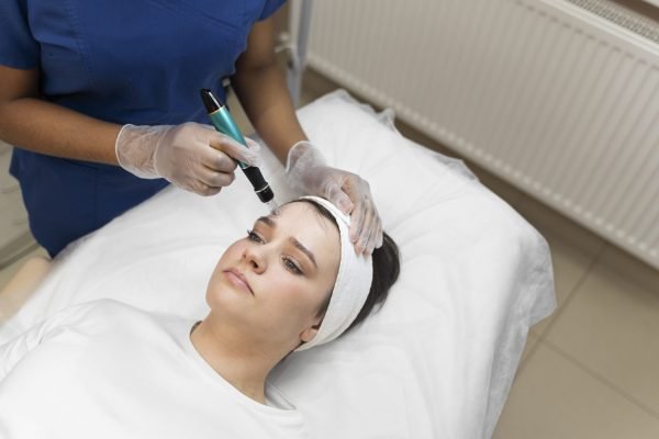 person-getting-micro-needling-beauty-treatment